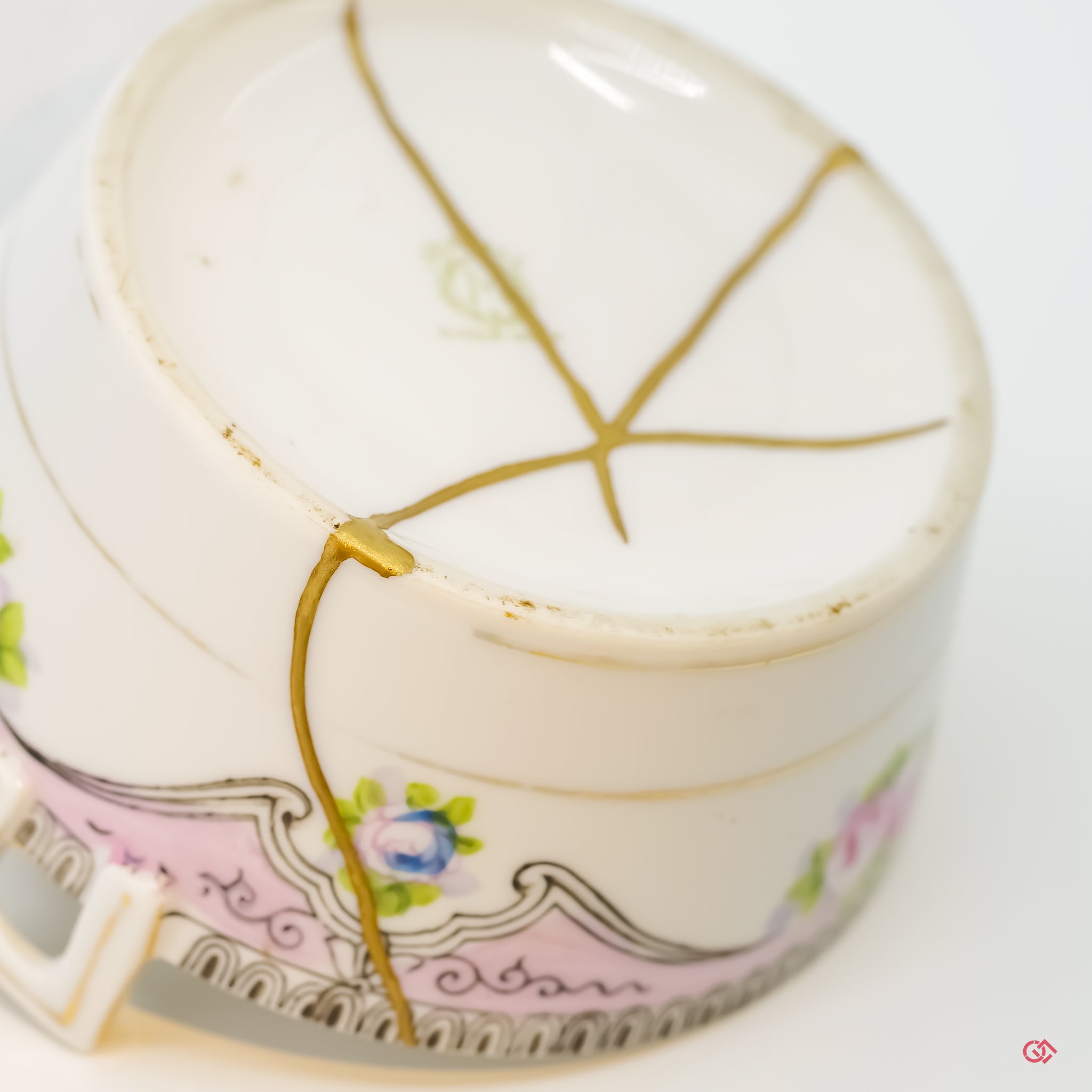 Detailed view of Kintsugi repair, showcasing craftsmanship and gold inlay.