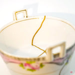 Close-up photo of an authentic Kintsugi pottery, showing the detail of its repairs and craftsmanship.