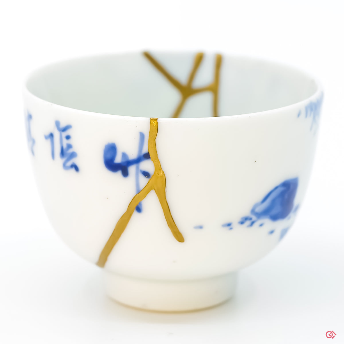 Close-up photo of genuine Kintsugi pottery, highlighting the artisan's intricate repair work and the unique character of each piece. Shop now.
