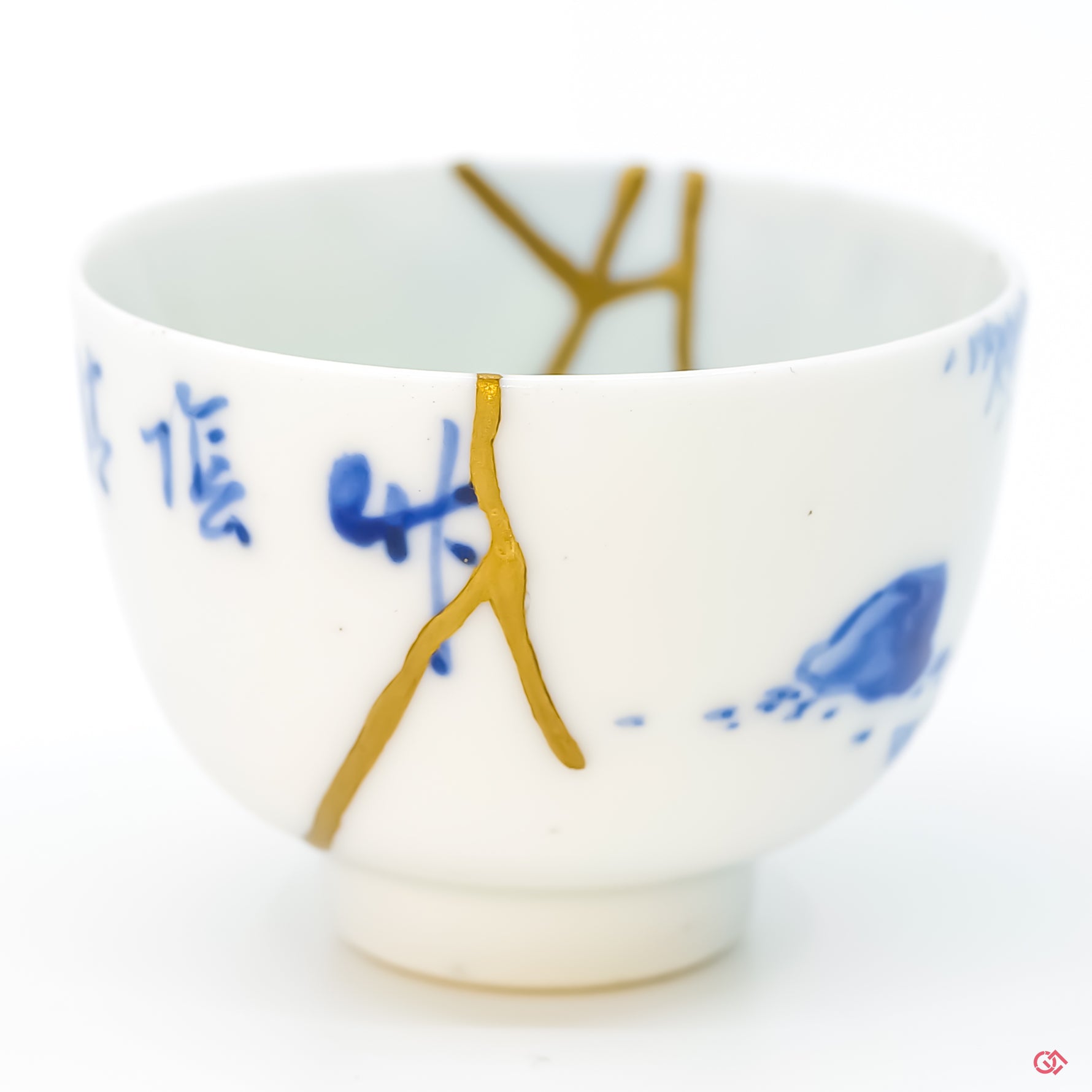 Close-up photo of genuine Kintsugi pottery, highlighting the artisan's intricate repair work and the unique character of each piece. Shop now.