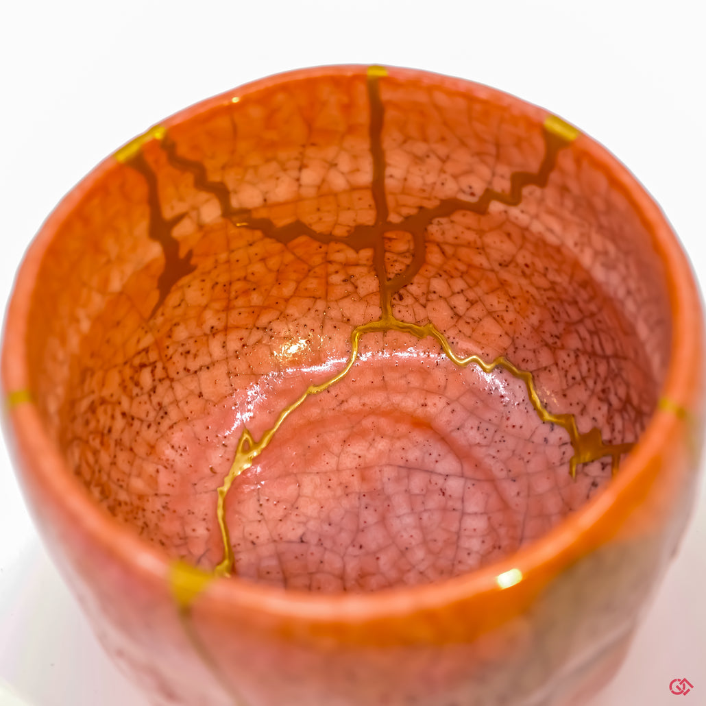 Close-up photo revealing the fine lines and textures of a traditional Kintsugi repair, demonstrating the skill of the Japanese artisan.