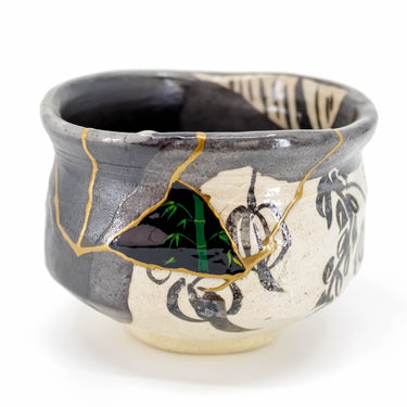 Unique kintsugi Black Oribe ware matcha bowl with multi-technique gold repair — timeless techniques and stunning craftsmanship, praised by a verified buyer from South Carolina