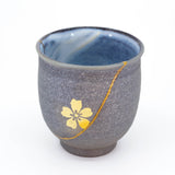 Authentic kintsugi Kyoto ware cup in dark gray with gold sakura blossom accent — impressed by authenticity, praised by an on-site buyer from London UK