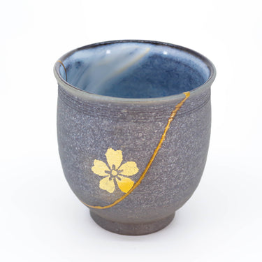 Authentic kintsugi Kyoto ware cup in dark gray with gold sakura blossom accent — impressed by authenticity, praised by an on-site buyer from London UK
