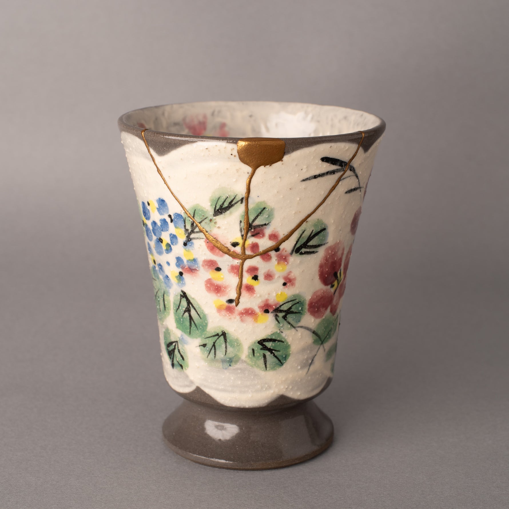 24K gold kintsugi Kyoto ware footed mug Petals in Stillness with delicate floral brushwork — exceptional customer care and thoughtful design praised by a verified buyer from North Dakota.