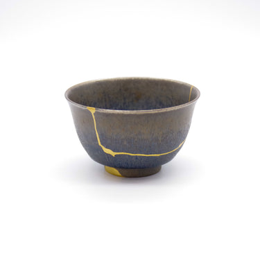 Authentic kintsugi Kyoto ware sake cup Tenmoku Cosmos with deep tenmoku glaze and 24K gold repair — a beautifully restored cup making the perfect gift, praised by a verified buyer from Massachusetts.