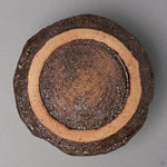 Kintsugi matcha bowl in Karatsu stoneware, its unglazed foot and rough iron-rich clay base, restored with natural urushi and 24K gold, bottom view.