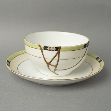 24K gold kintsugi early Noritake cup and saucer The Gilded Garden with ivory porcelain and gold restoration — chosen as the perfect birthday gift by a verified buyer from Florida
