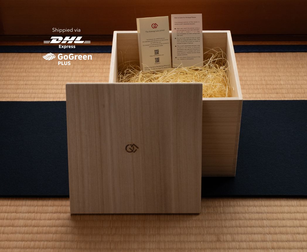 Kintsugi piece packaged in traditional paulownia wood gift box, shipped worldwide via DHL GoGreen Plus for carbon-neutral delivery.
