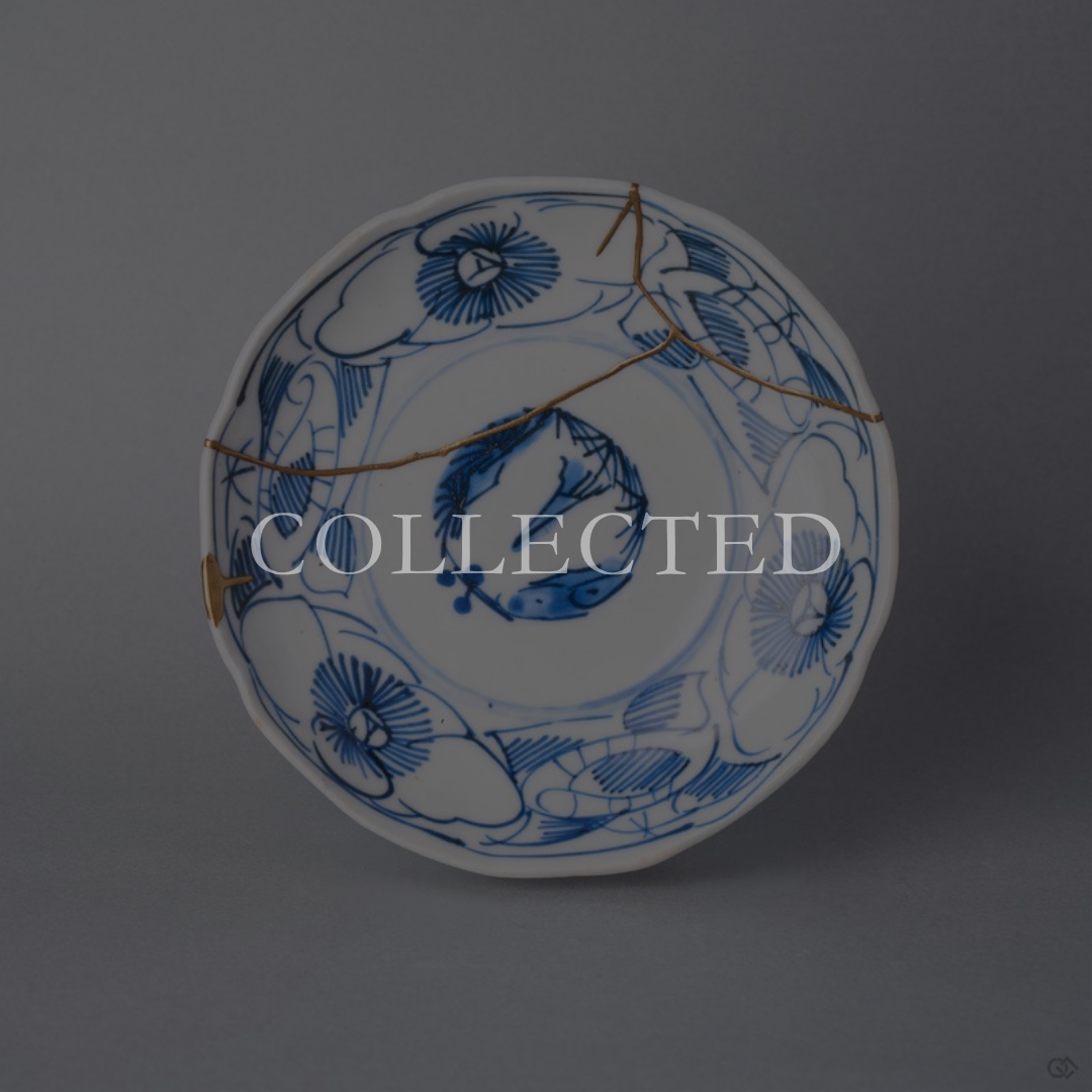 Kintsugi plate in Ko-Imari sometsuke porcelain with line-drawn camellias, restored with natural urushi and 24K gold, front view. Collected.