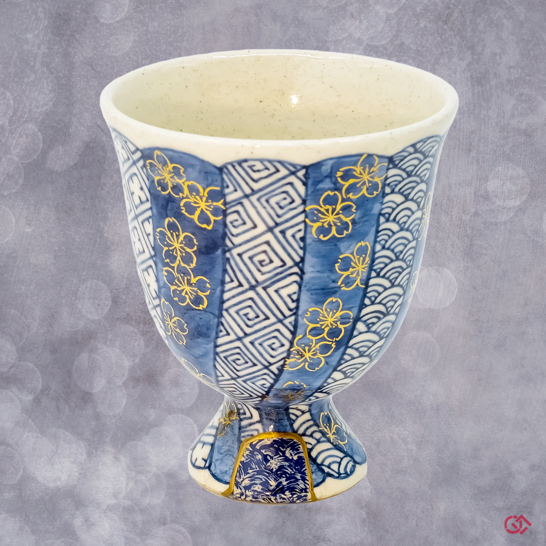 Authentic Japanese Kintsugi: Broken pottery restored with gold, embodying Wabi-Sabi philosophy.