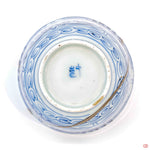 A photo of the bottom of an authentic Kintsugi pottery piece, showing its overall design and features.