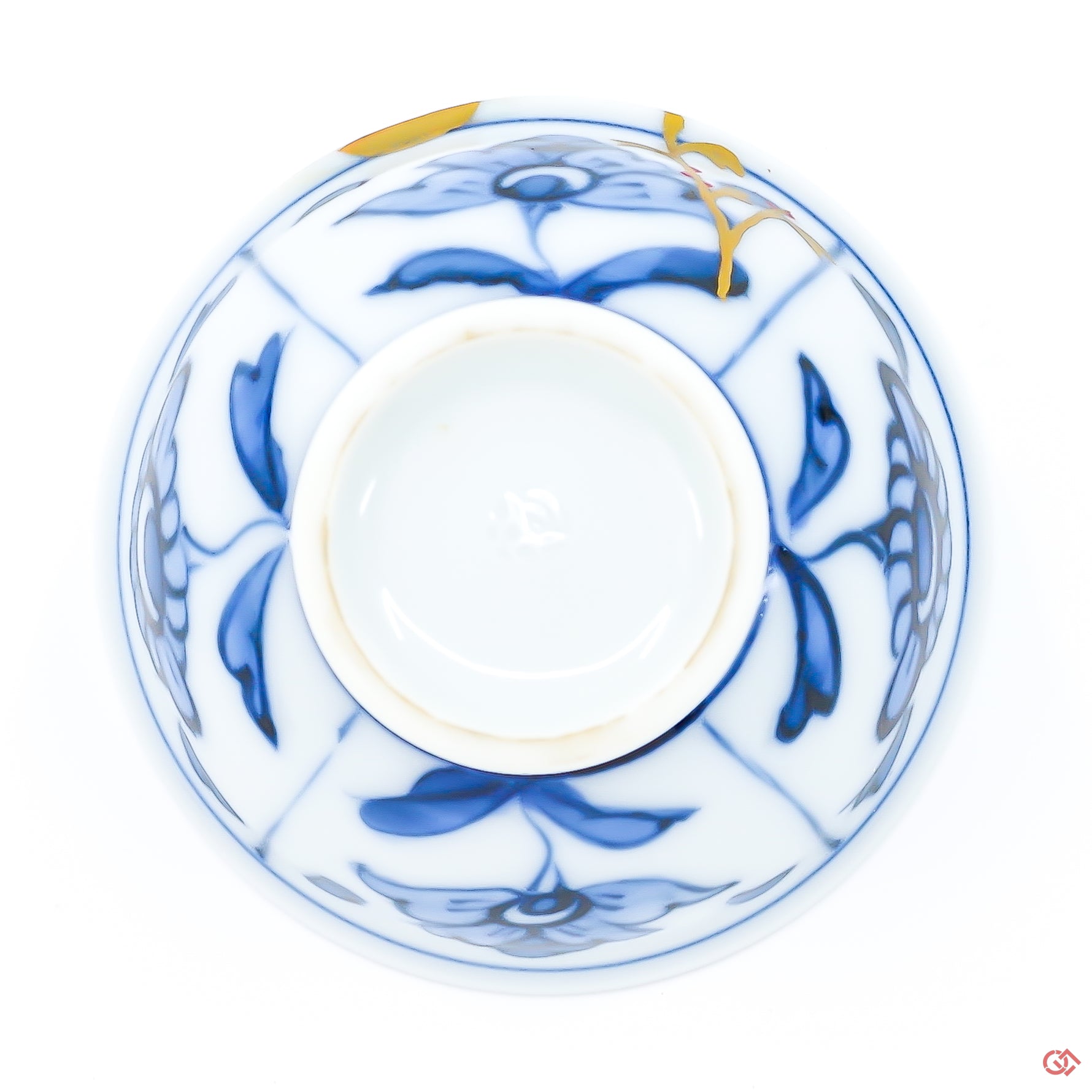 Photo of the bottom side of an authentic Kintsugi pottery piece, showing its overall design and features