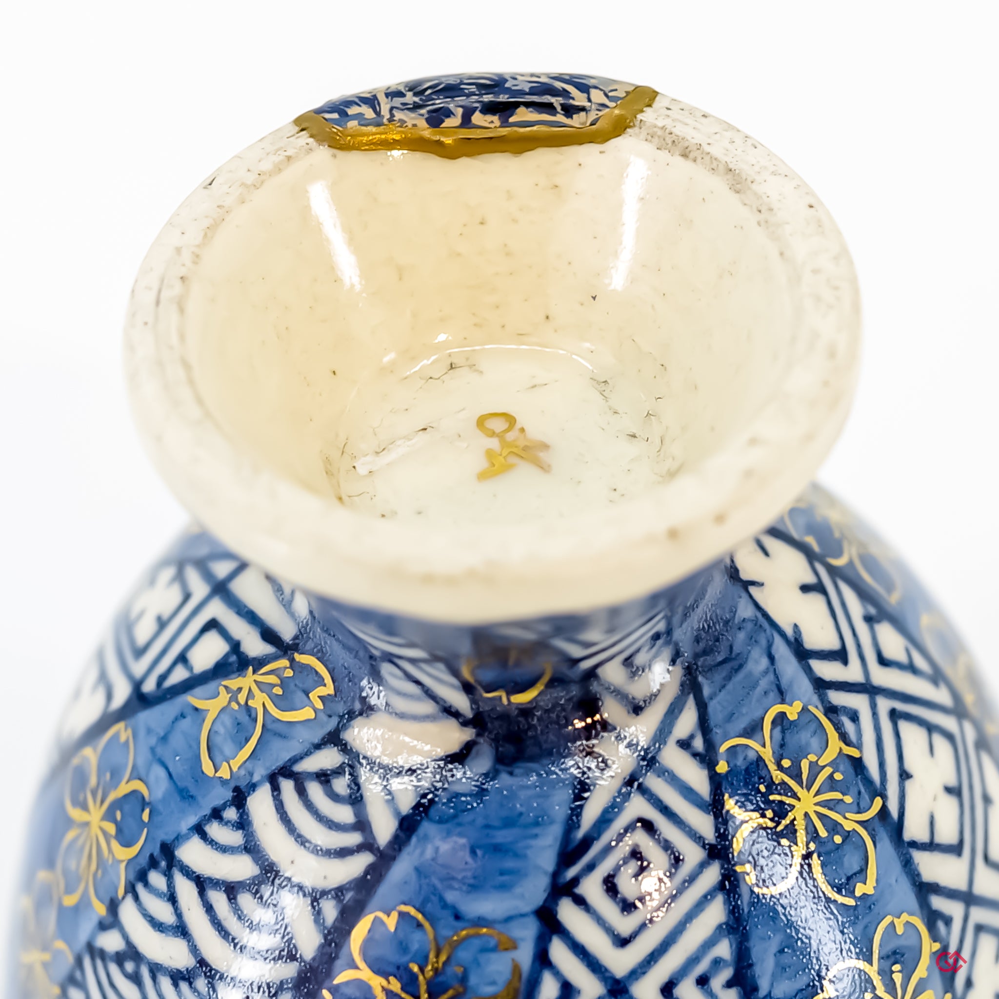 Close-up photo of an authentic Kintsugi pottery, showing the detail of its repairs and craftsmanship.