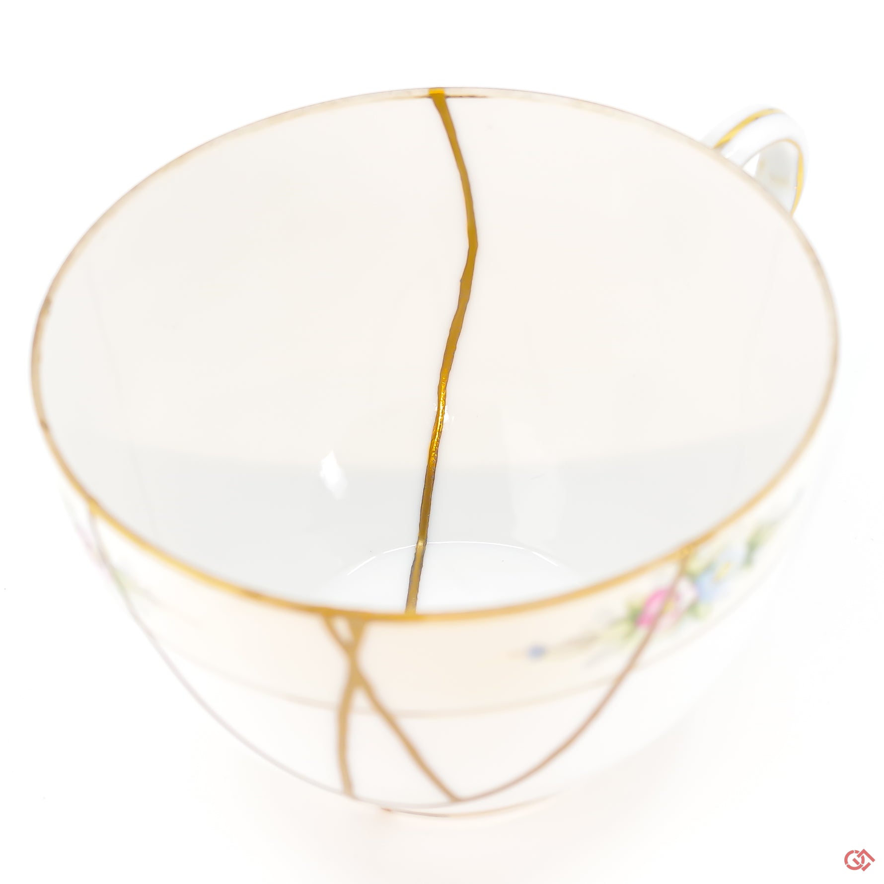 A close-up photo of an authentic Kintsugi pottery piece, showing the detail of its repairs and craftsmanship.