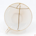 A photo of the top of an authentic Kintsugi pottery piece, showing its overall design and features.
