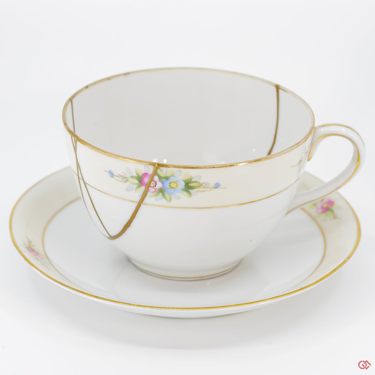 A close-up photo of an authentic Kintsugi pottery piece, showing the detail of its repairs and craftsmanship.