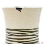 Discover the beauty of Kintsugi: Close-up of hand-repaired pottery.
