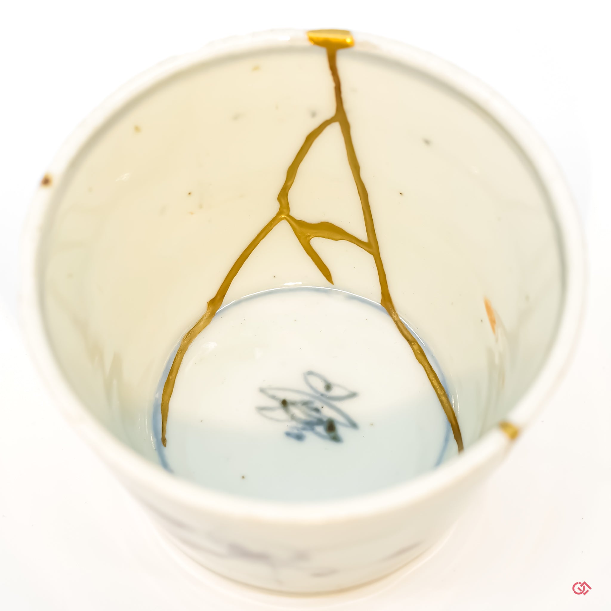 Close-up photo of an authentic Kintsugi pottery, showing the detail of its repairs and craftsmanship.