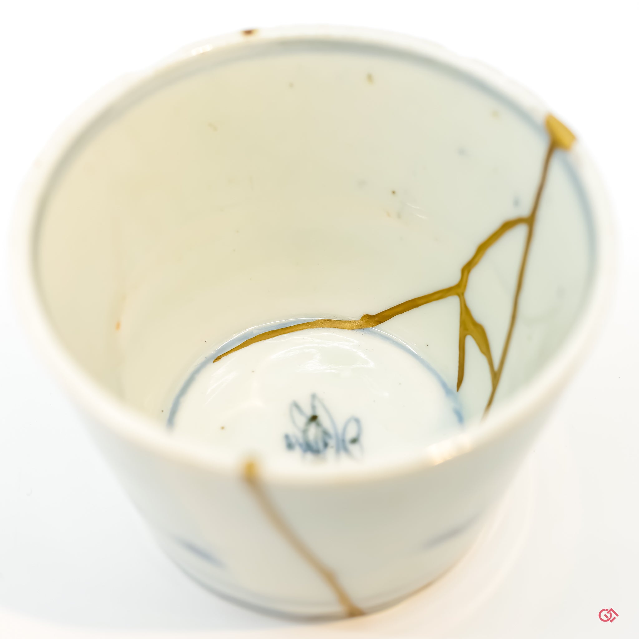 Detailed view of Kintsugi repair, showcasing craftsmanship and gold inlay.