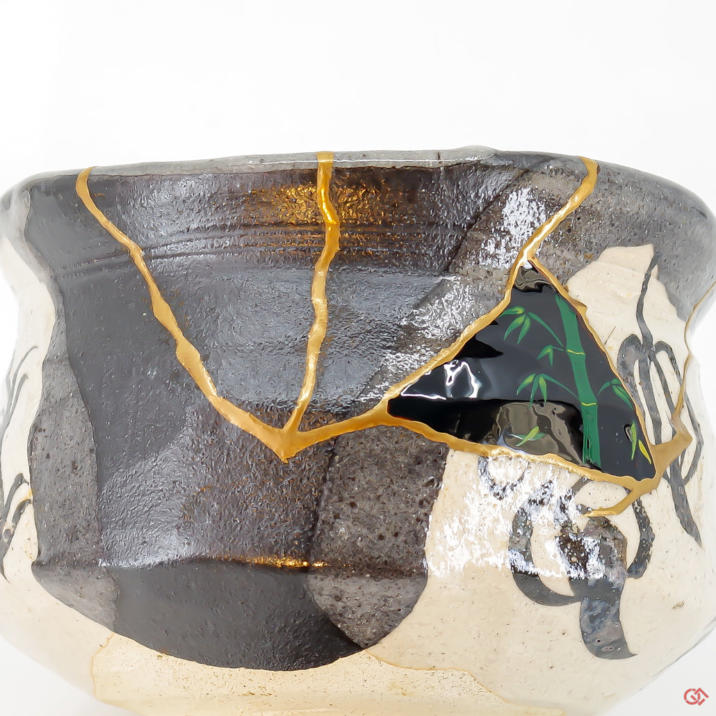 A close-up photo of an authentic Kintsugi pottery piece, showing the detail of its repairs and artisty. craftsmanship.