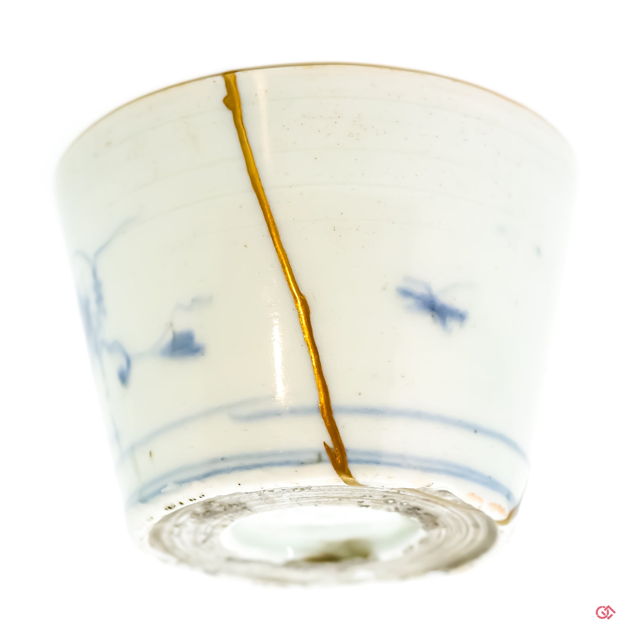 Intricate Kintsugi repair detail, highlighting the texture of gold on a restored ceramic piece.