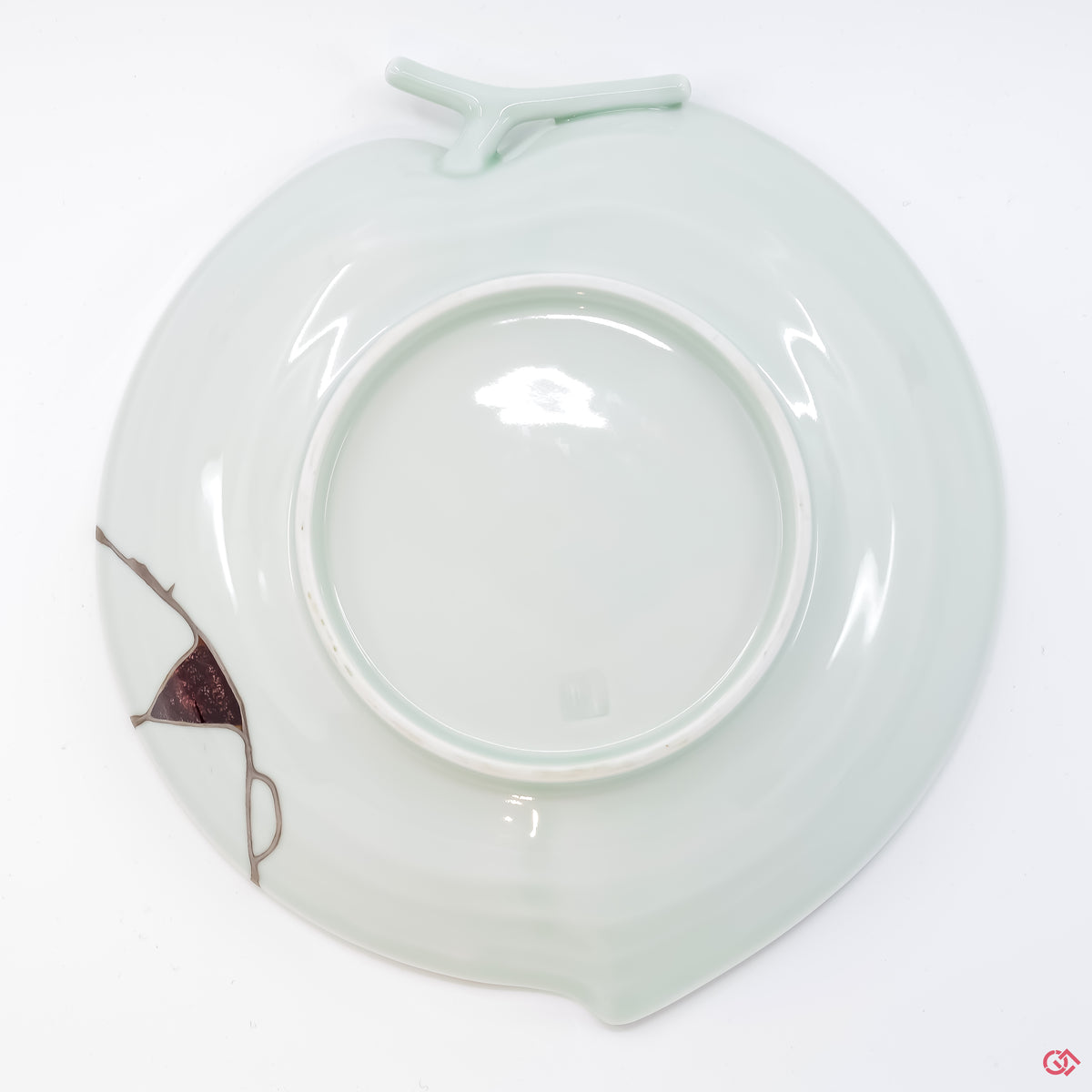 Photo of the bottom side of an authentic Kintsugi pottery, showing its overall design and features