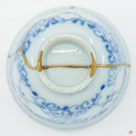Underside view of authentic Kintsugi pottery, showcasing repair details and craftsmanship.