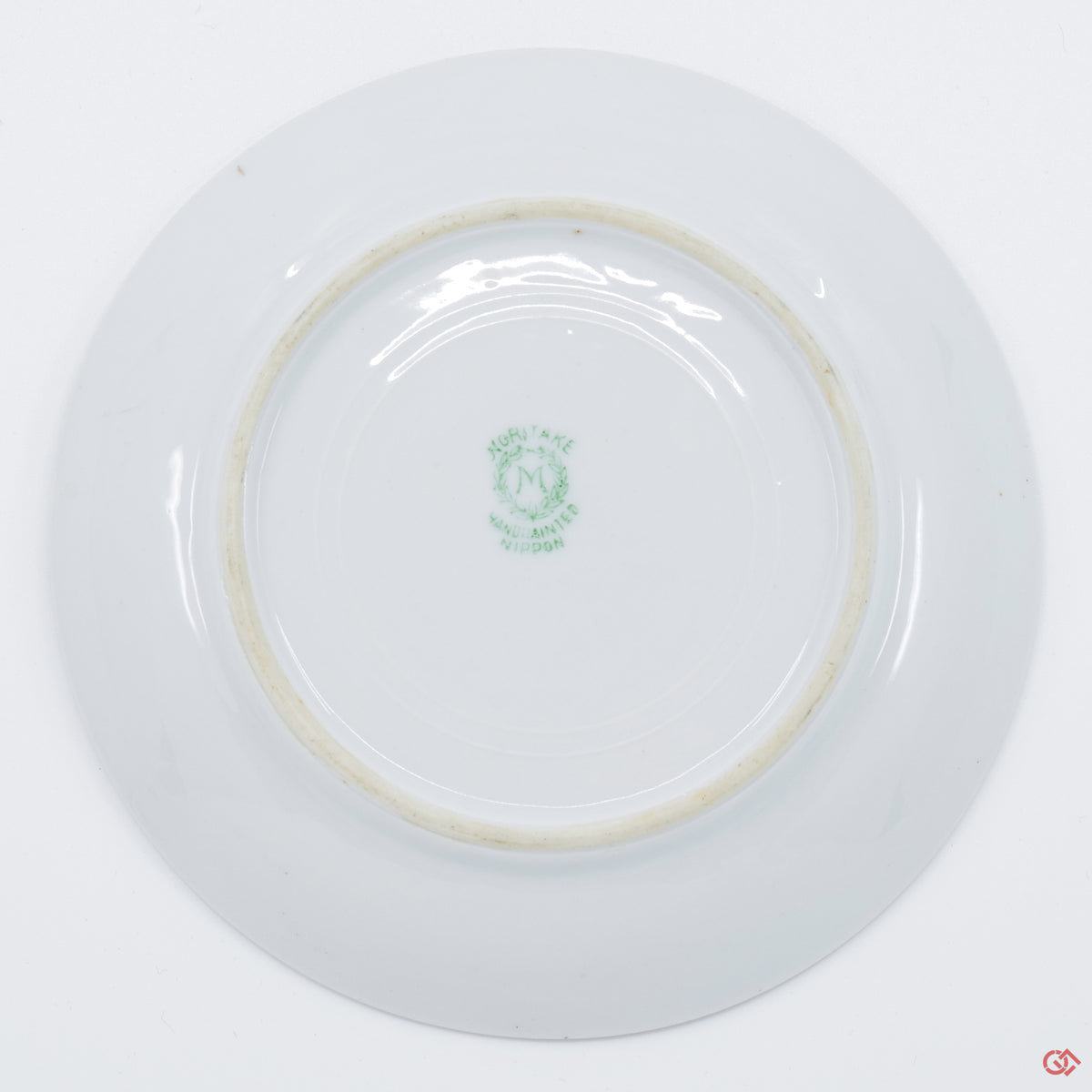 Photo of the bottom side of an authentic Kintsugi pottery piece, showing its overall design and features