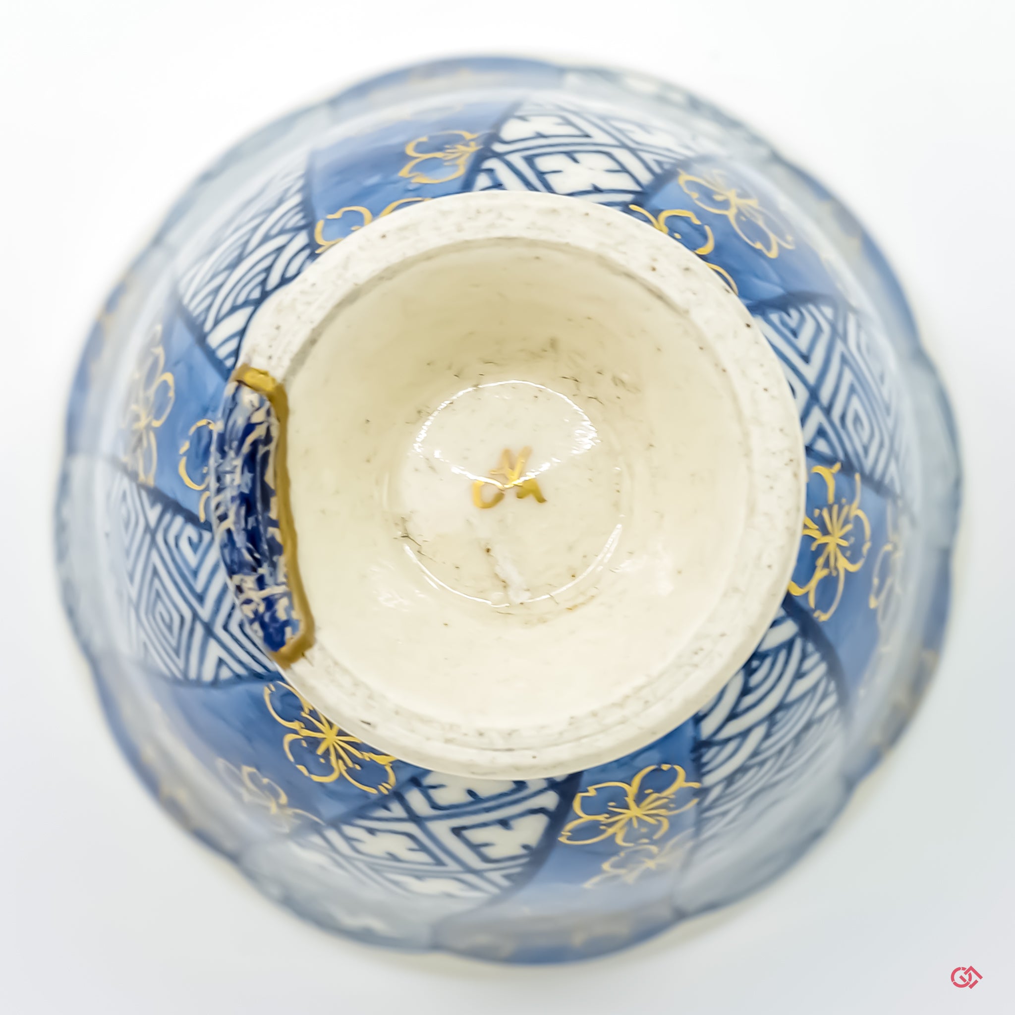 Underside view of authentic Kintsugi pottery, showcasing repair details and craftsmanship.