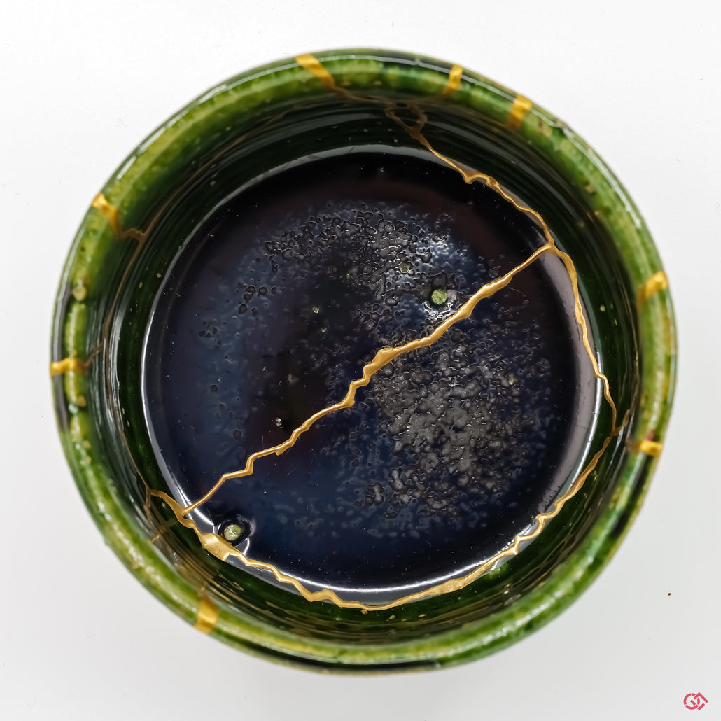 Photo of the top side of an authentic Kintsugi pottery piece, showing its overall design and features.