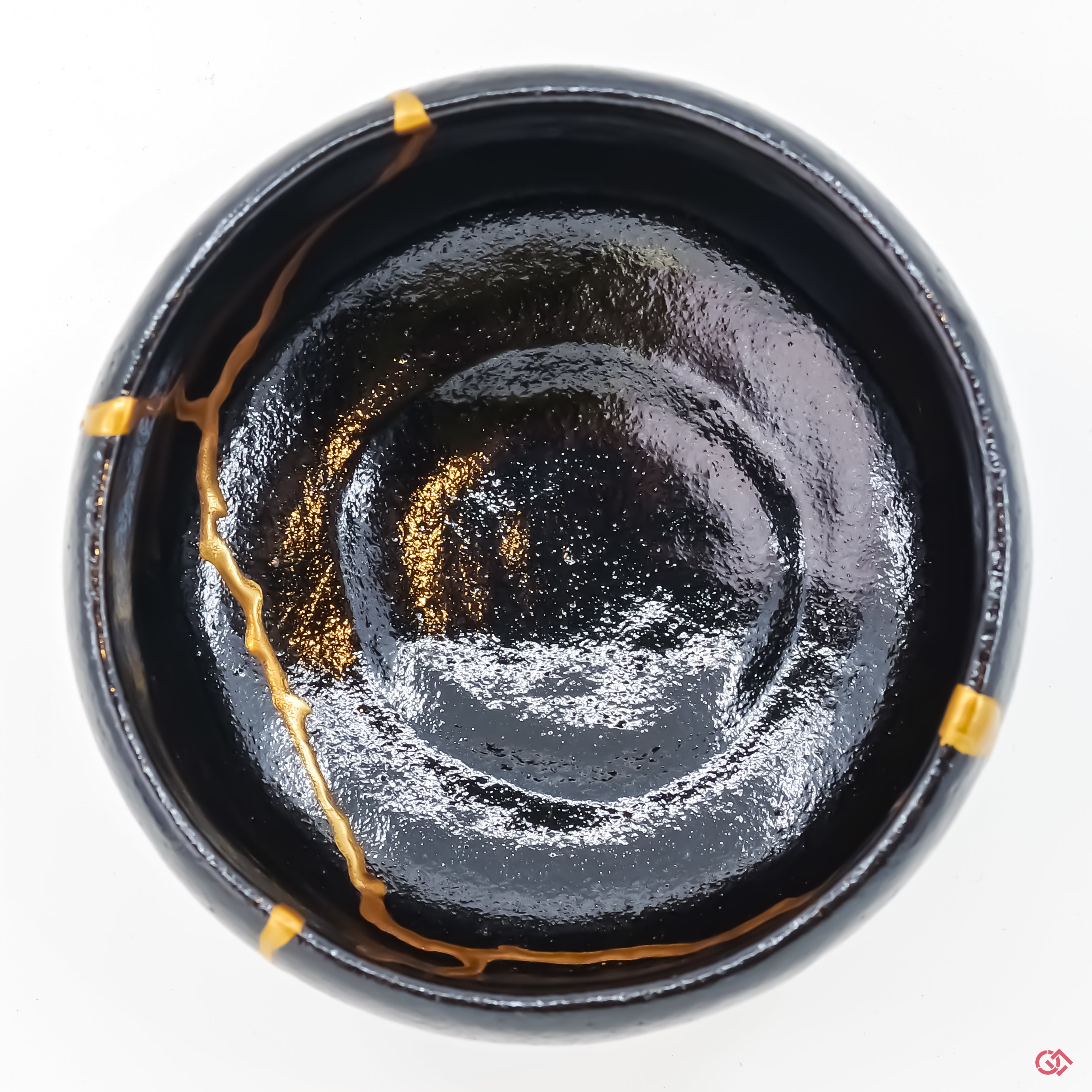 Explore the artistry of authentic Kintsugi: Top view of unique, repaired pottery.