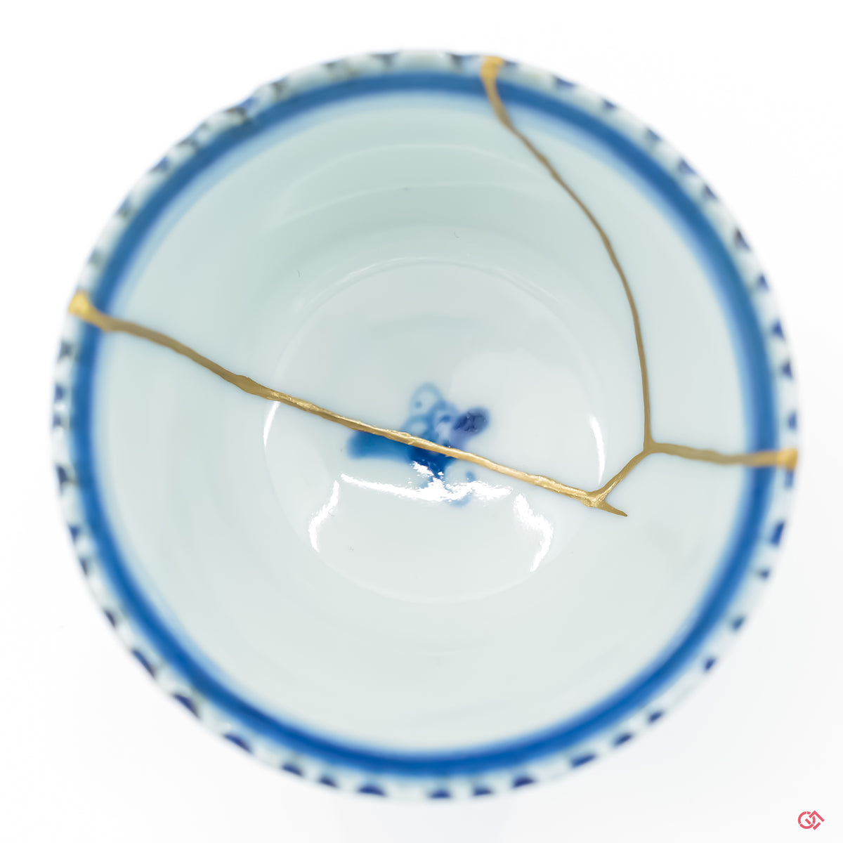 Close up of a kintsugi repaired crack, with clear visual of the gold adhered to the ceramic.