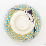 A photo of the bottom of an authentic Kintsugi pottery piece, showing its overall design and features.