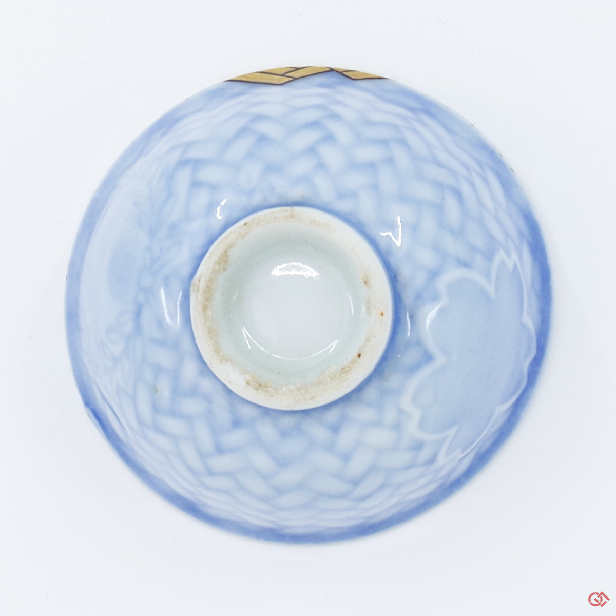 Photo of the bottom side of an authentic Kintsugi pottery piece, showing its overall design and features