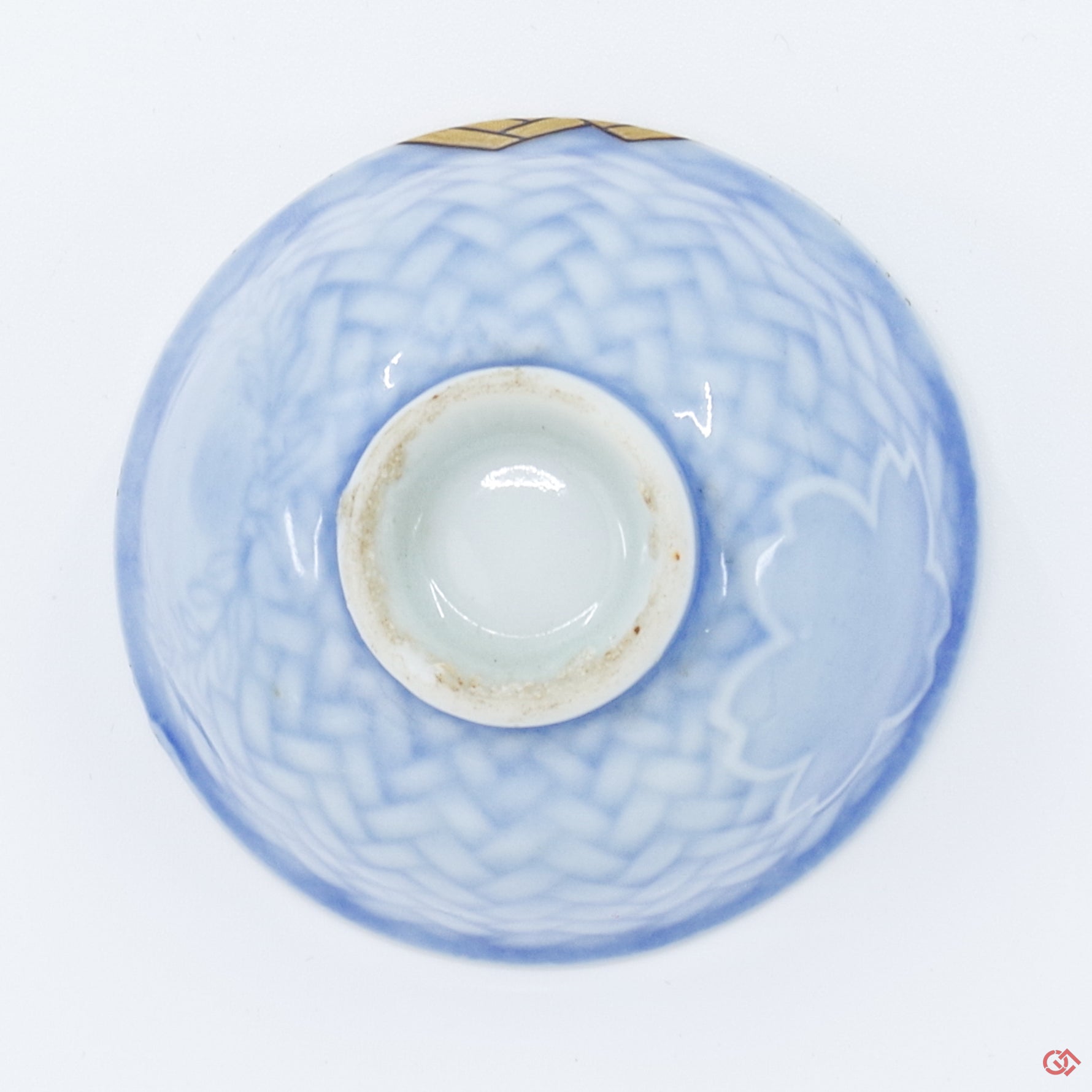 Photo of the bottom side of an authentic Kintsugi pottery piece, showing its overall design and features