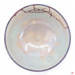 Discover the full beauty of Kintsugi: Top view of repaired pottery.