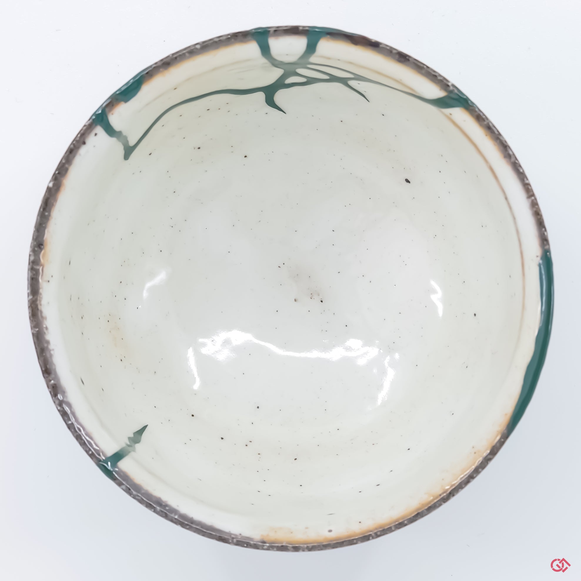 Explore the artistry of authentic Kintsugi: Top view of unique, repaired pottery.