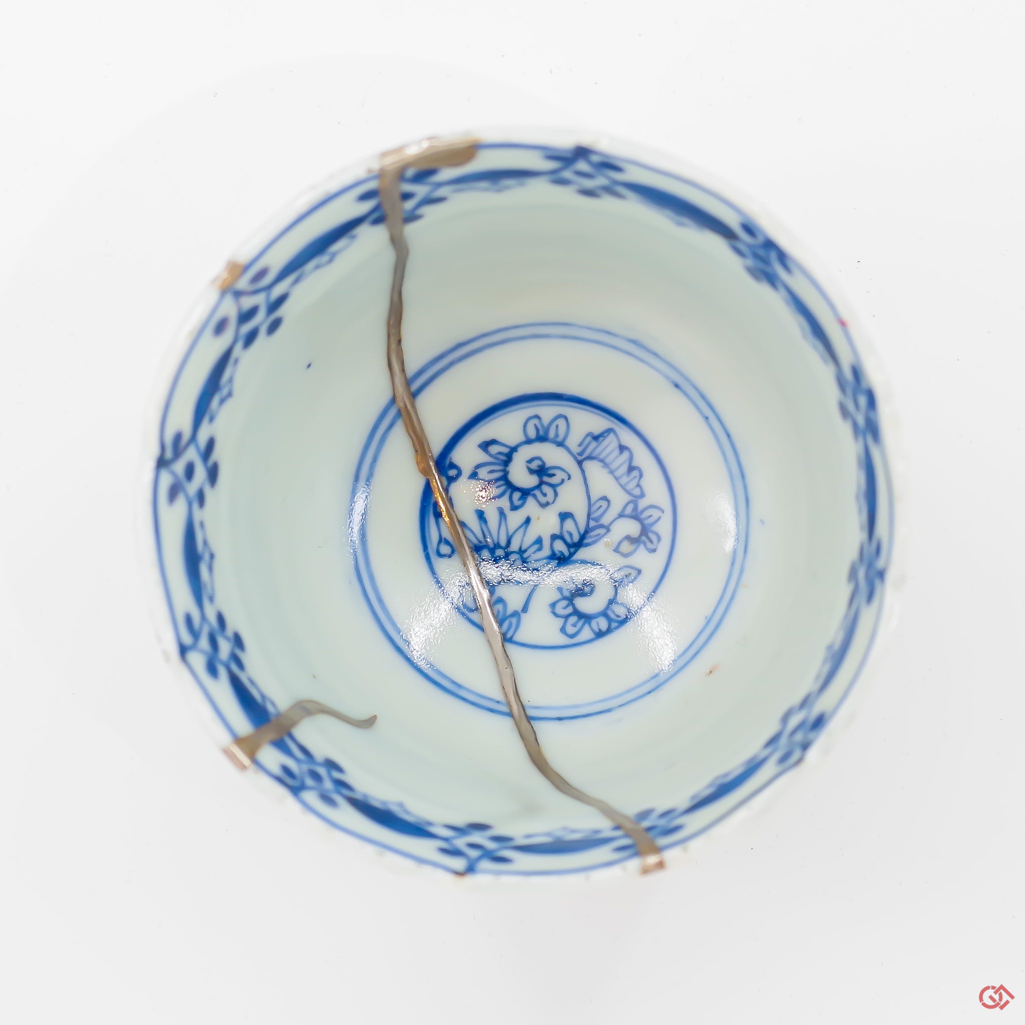 A photo of the top of an authentic Kintsugi pottery piece, showing its overall design and features.