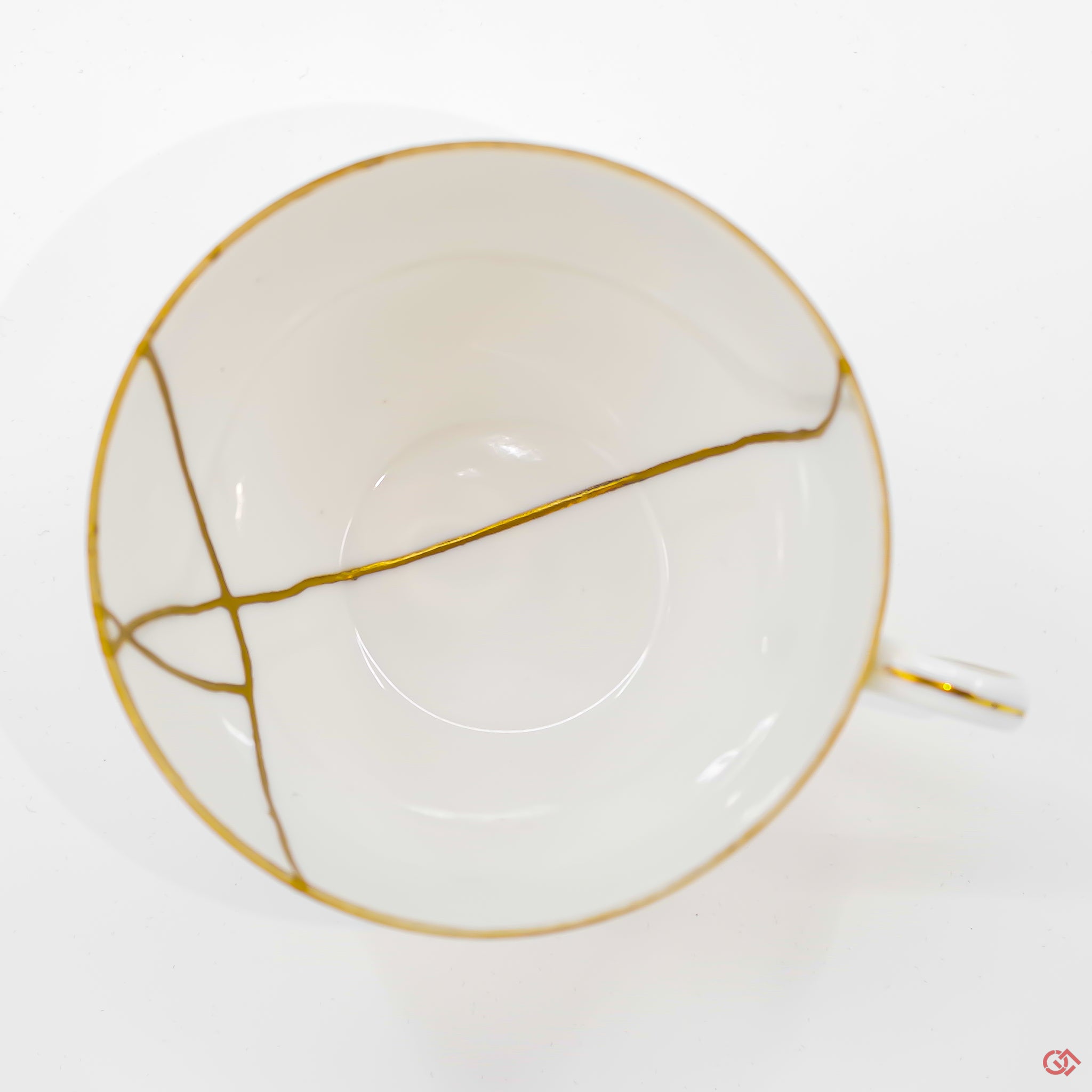 A photo of the top of an authentic Kintsugi pottery piece, showing its overall design and features.