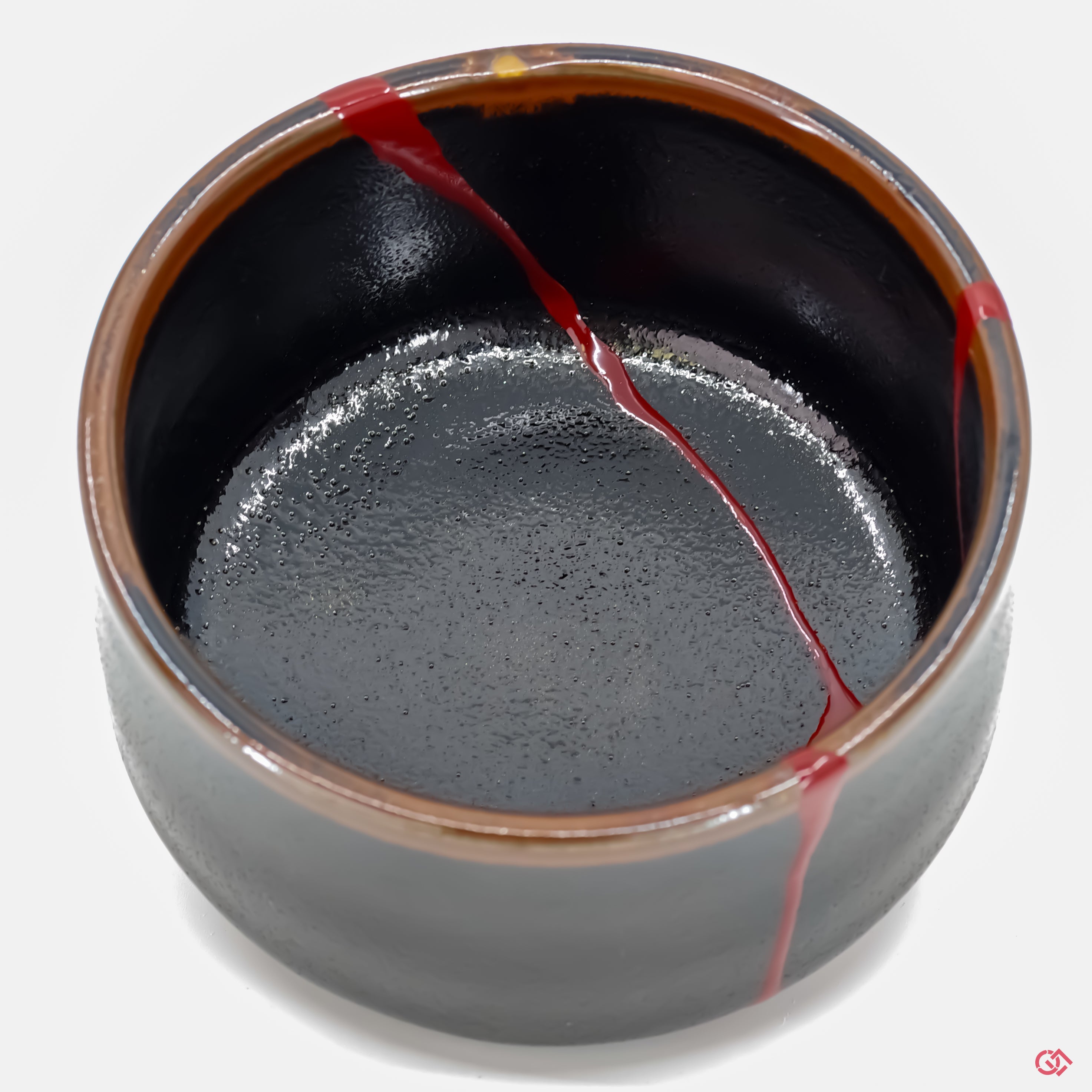 Close-up photo of an authentic Kintsugi pottery, showing the detail of its repairs and craftsmanship.