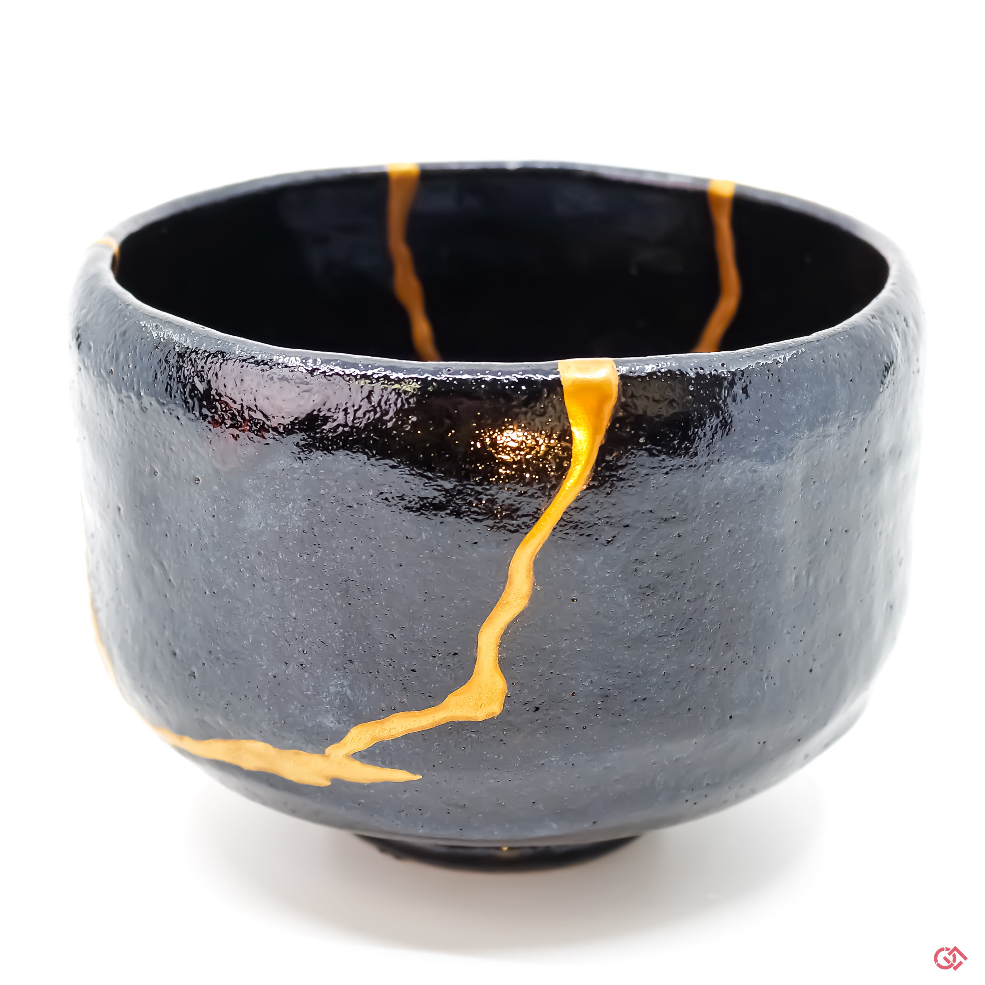 Detailed view of Kintsugi repair, showcasing craftsmanship and gold inlay.