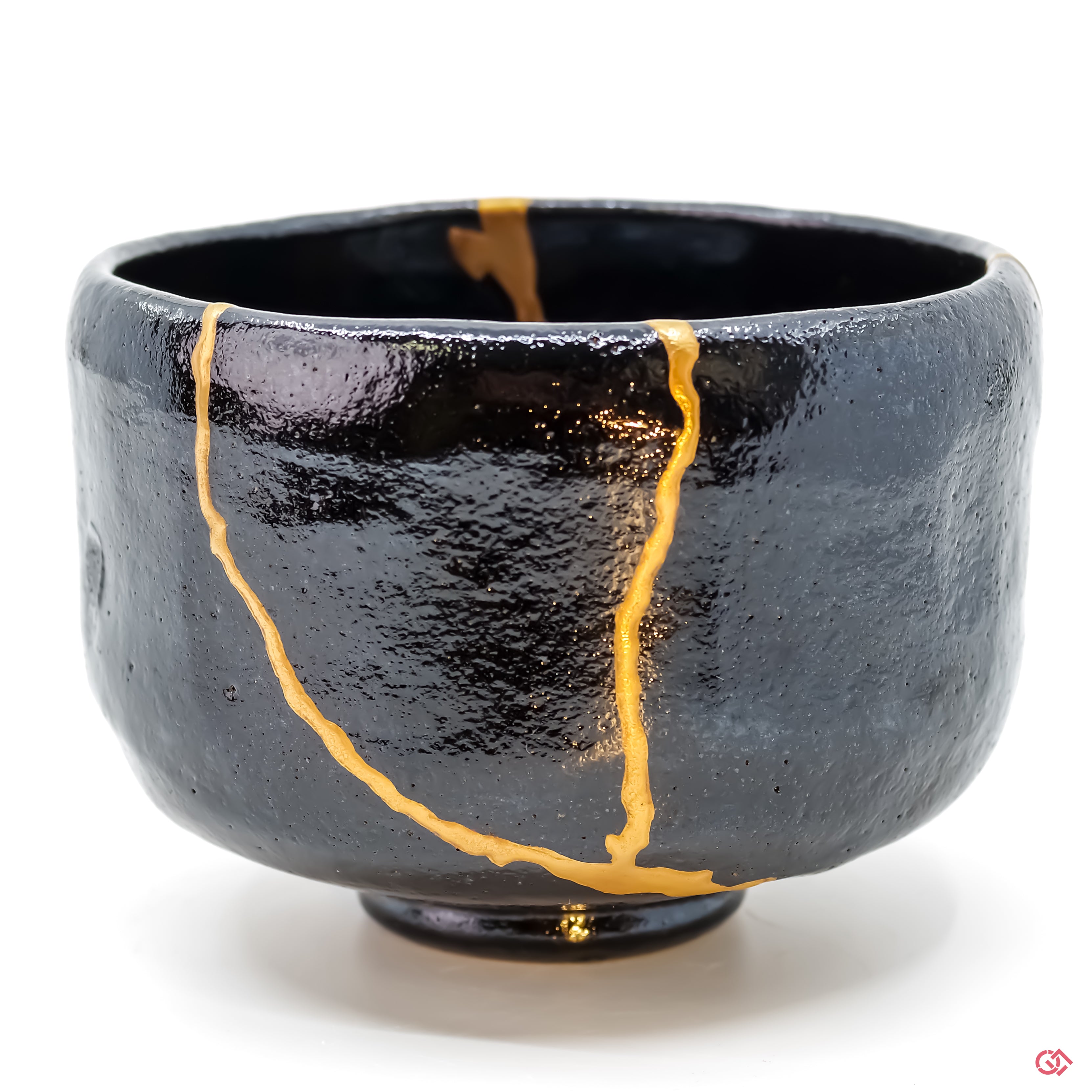 Close-up photo of an authentic Kintsugi pottery, showing the detail of its repairs and craftsmanship.