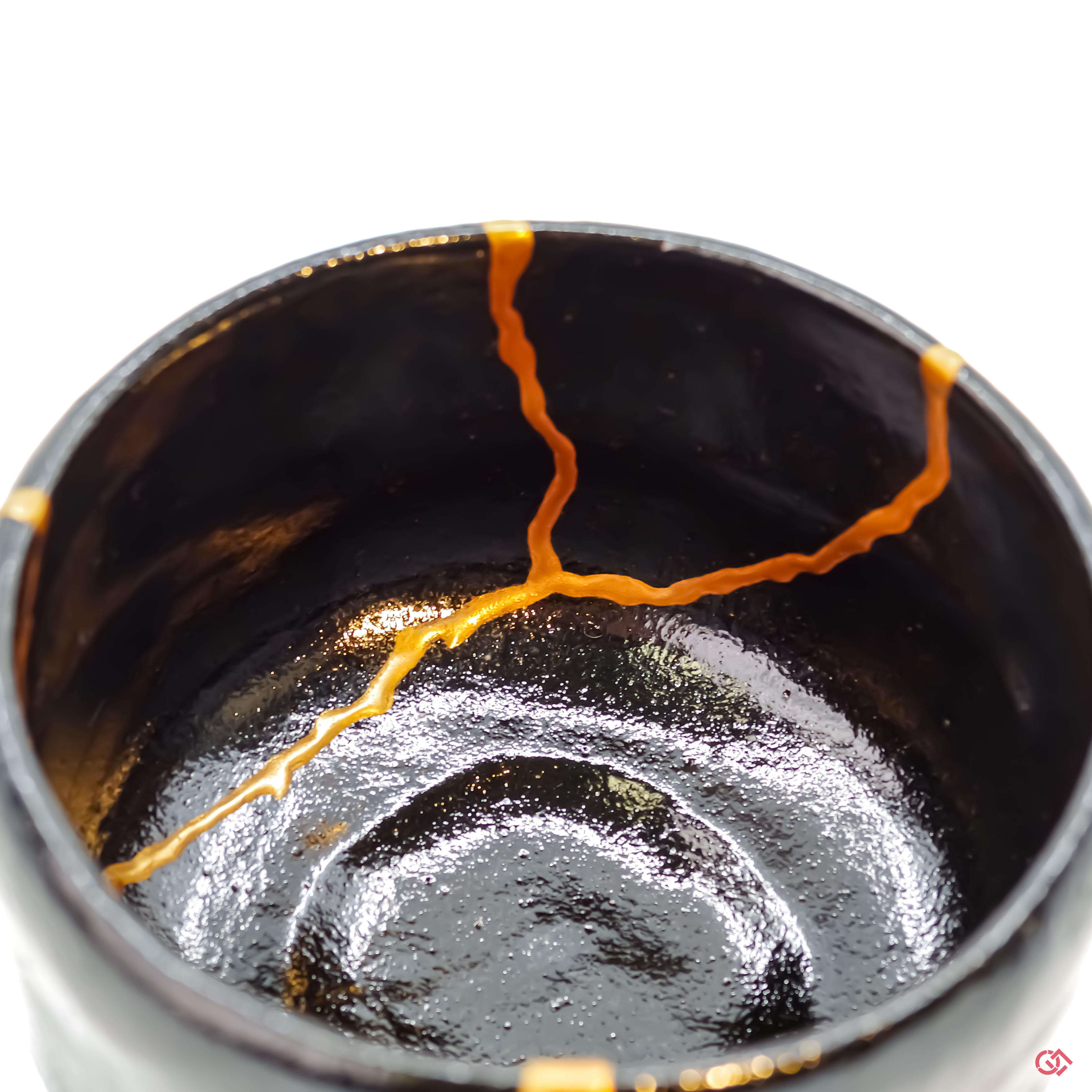 Detailed view of Kintsugi repair, showcasing craftsmanship and gold inlay.