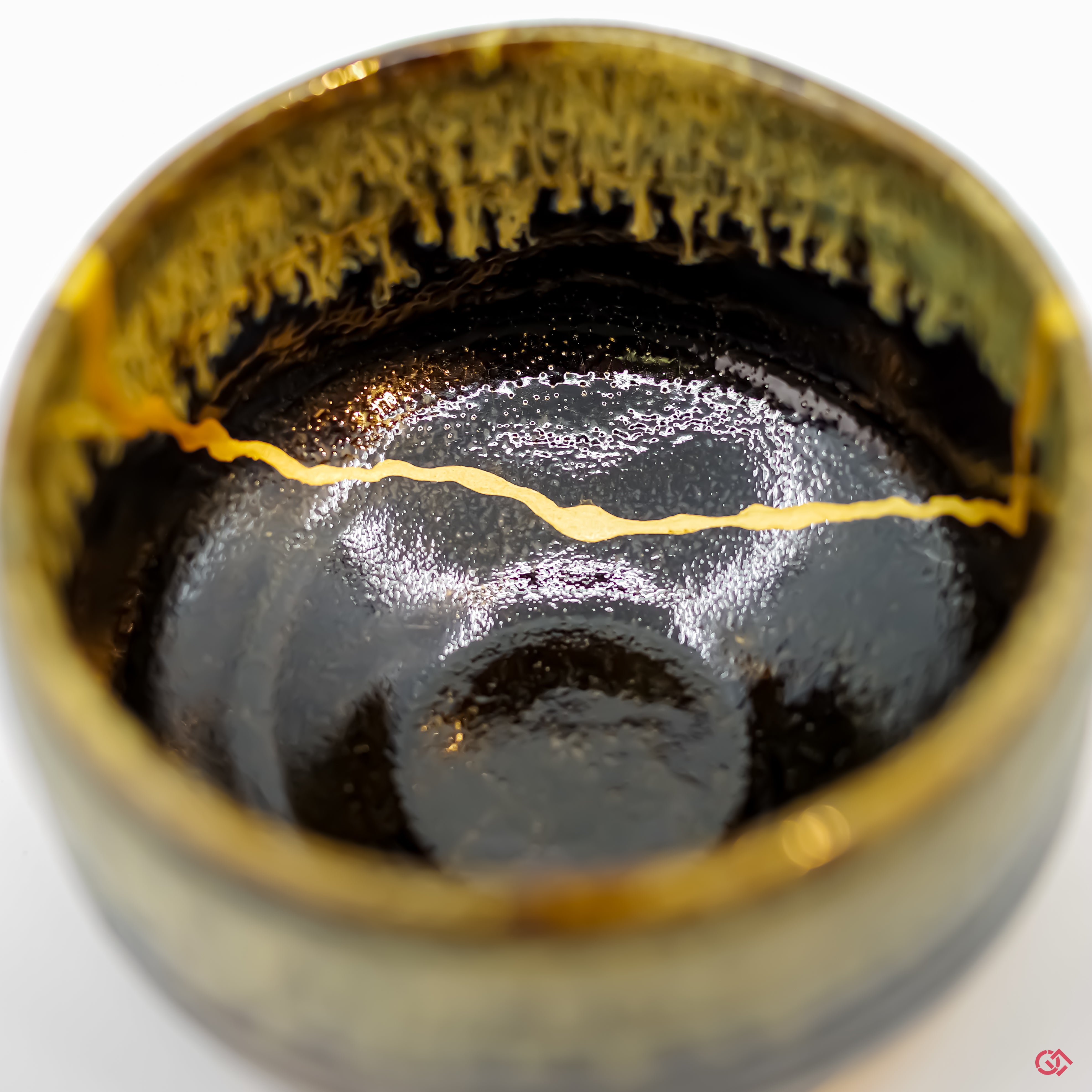 Close-up photo of an authentic Kintsugi pottery, showing the detail of its repairs and craftsmanship.