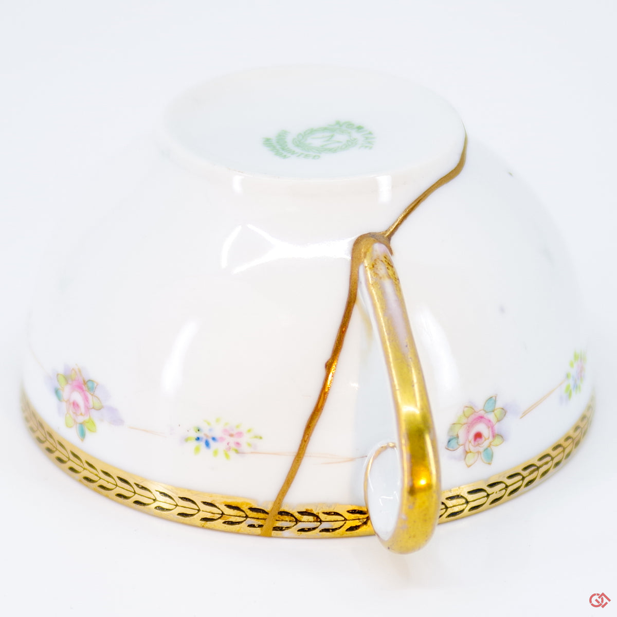 Close-up photo of an authentic Kintsugi pottery piece, showing the detail of its repairs and craftsmanship