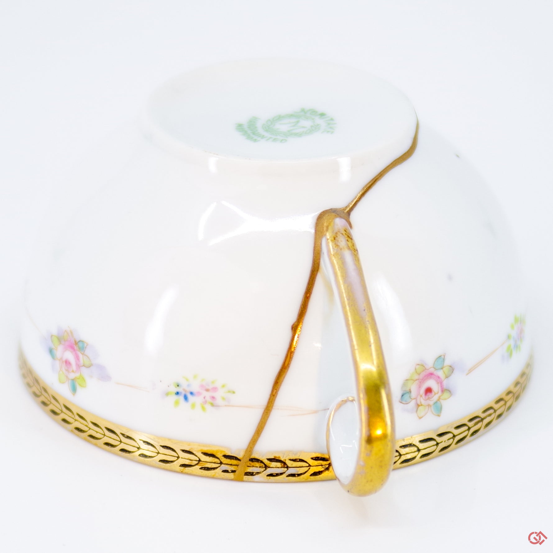 Close-up photo of an authentic Kintsugi pottery piece, showing the detail of its repairs and craftsmanship