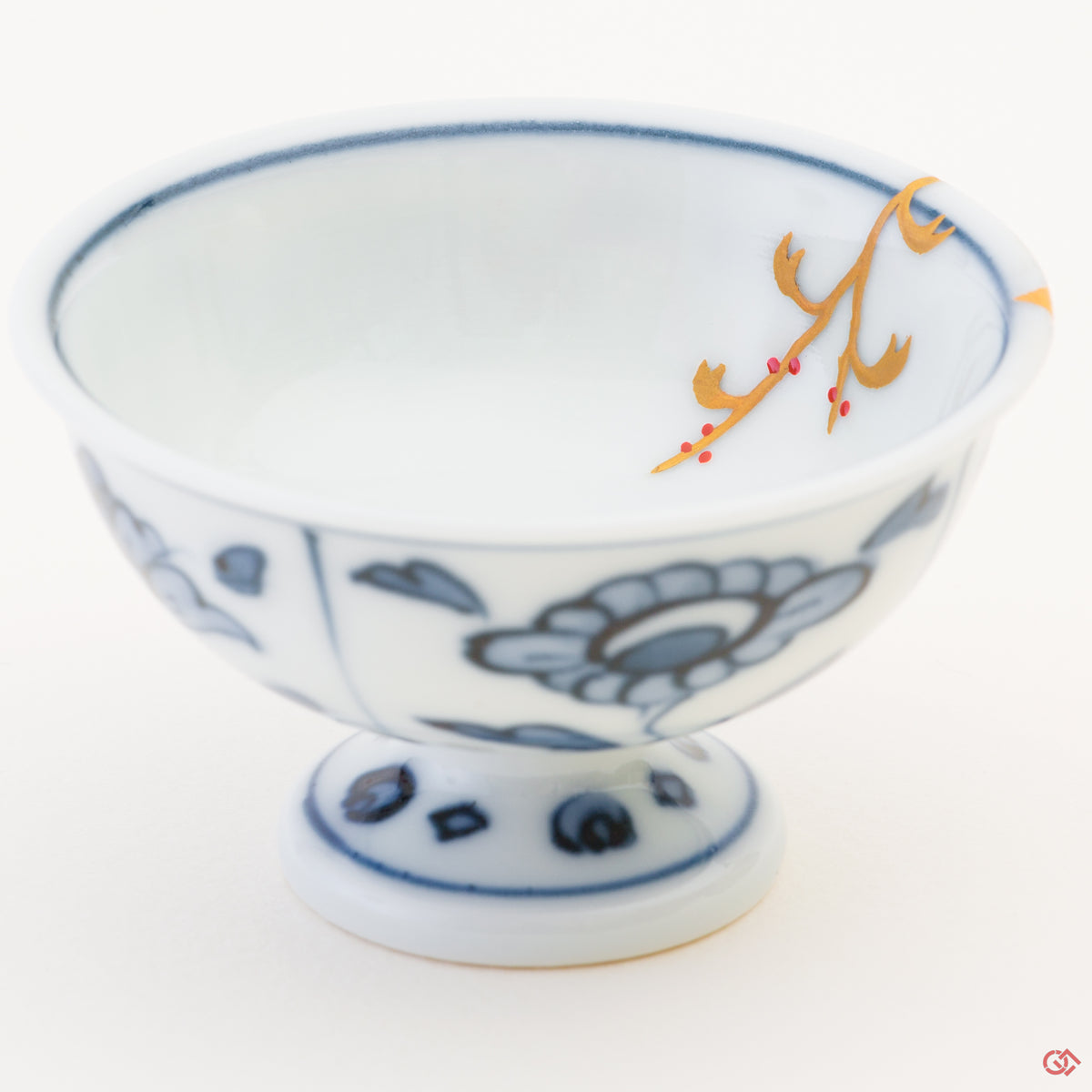 Close-up photo of an authentic Kintsugi pottery piece, showing the detail of its repairs and craftsmanship