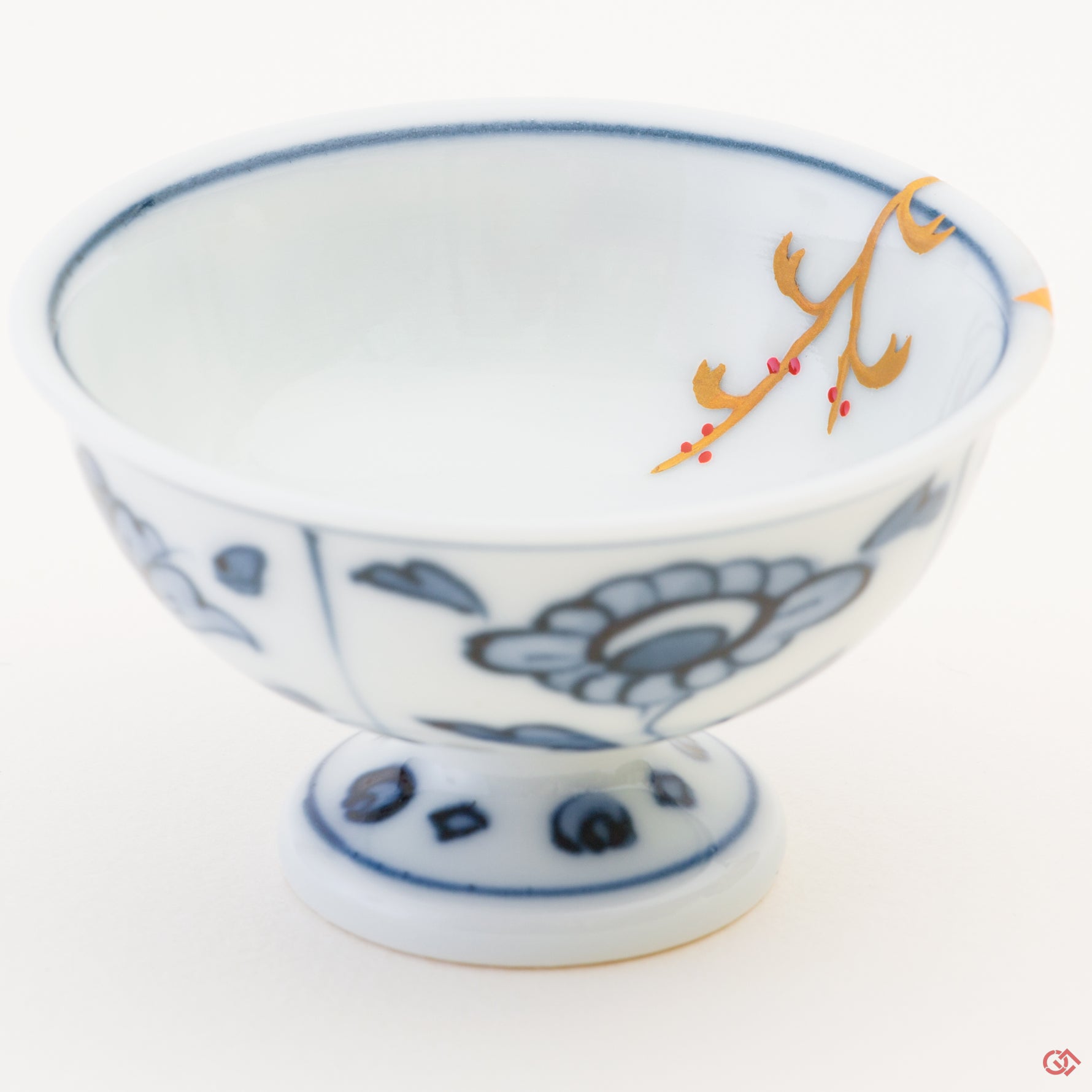 Close-up photo of an authentic Kintsugi pottery piece, showing the detail of its repairs and craftsmanship