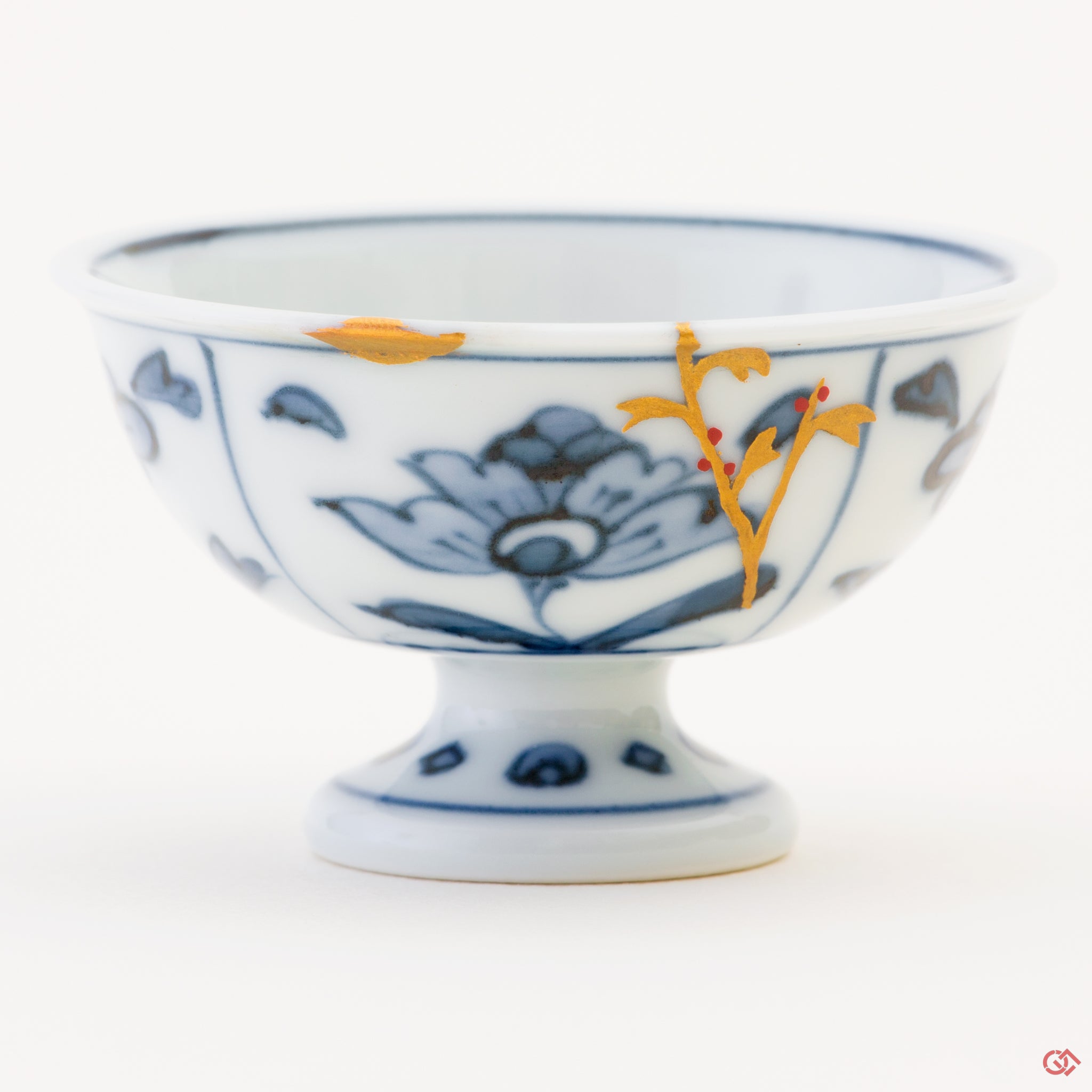 Close-up photo of an authentic Kintsugi pottery piece, showing the detail of its repairs and craftsmanship: